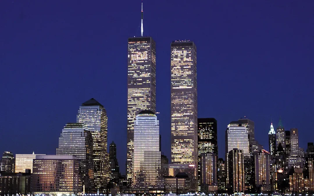 Night view of New York City skyline with illuminated Twin Towers, honoring 9/11 funeral director heroes